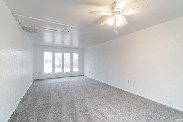 carpeted empty room with ceiling fan