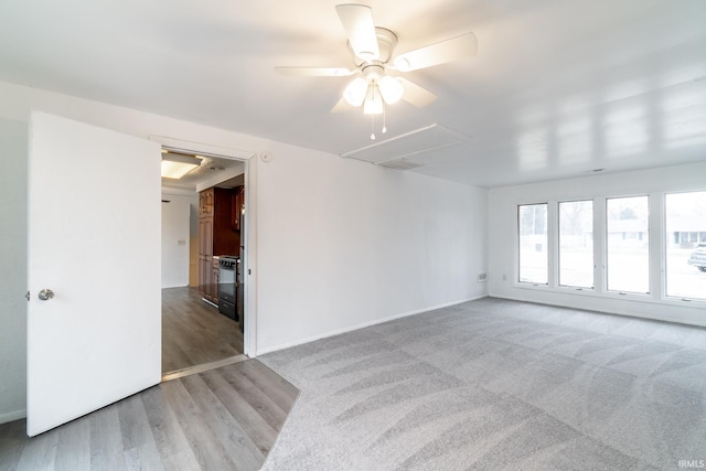 carpeted empty room with ceiling fan