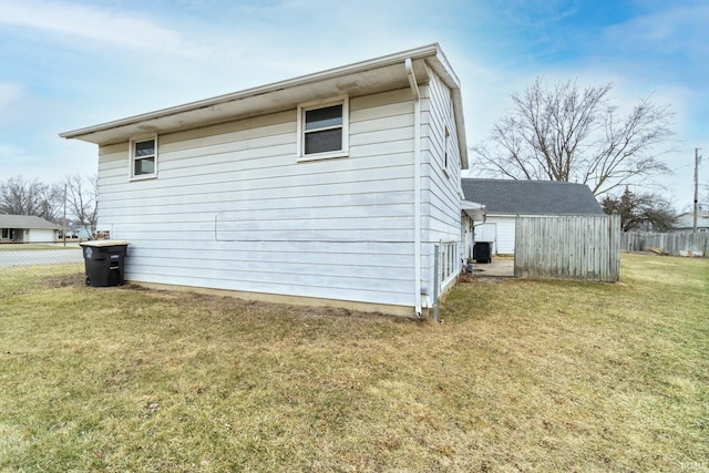 view of side of property with a yard