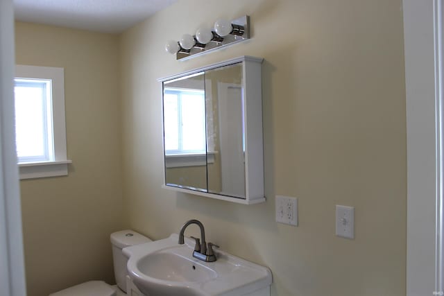 bathroom with sink and toilet