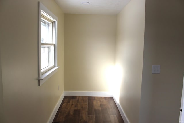 corridor featuring dark hardwood / wood-style flooring