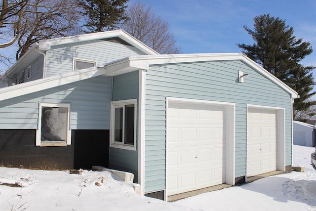 view of snow covered garage