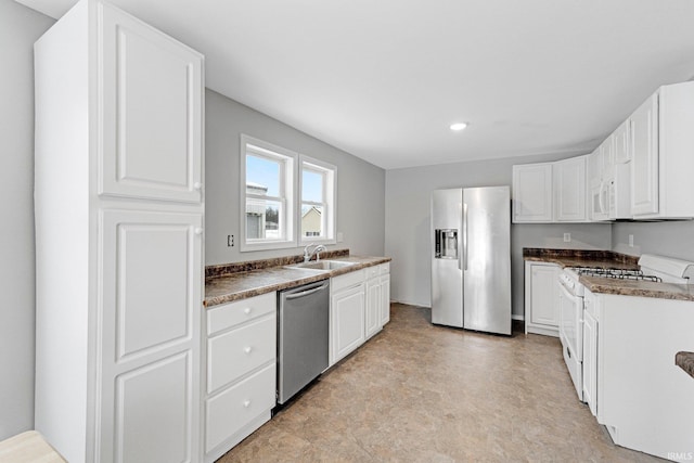 kitchen with white cabinetry, appliances with stainless steel finishes, and sink