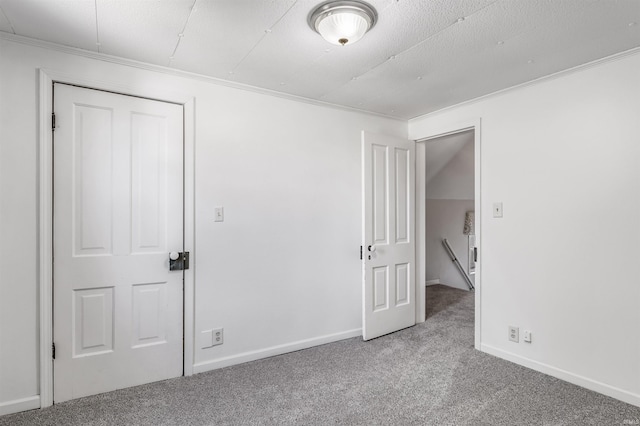 unfurnished bedroom featuring ornamental molding and carpet flooring