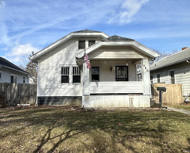 view of front of house with a front lawn and a porch