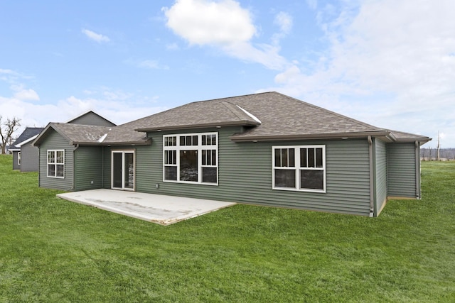 back of house with a yard and a patio area