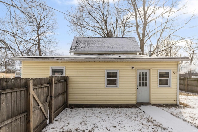 view of snow covered house