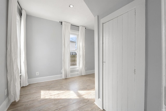 interior space with a closet and light wood-type flooring