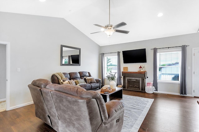 living room with vaulted ceiling, dark hardwood / wood-style floors, and ceiling fan