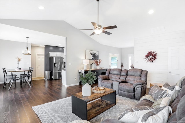 living room with vaulted ceiling, dark hardwood / wood-style floors, and ceiling fan