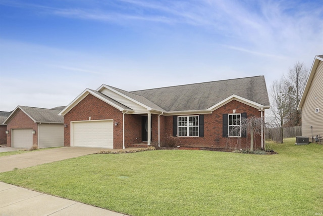 ranch-style home with a garage, central AC unit, and a front yard