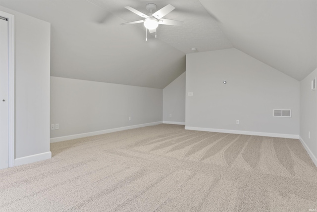 bonus room with ceiling fan, carpet flooring, and vaulted ceiling