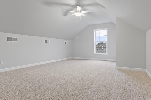 bonus room with light carpet, vaulted ceiling, and ceiling fan