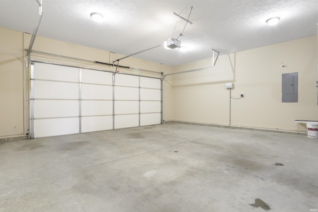 garage featuring a garage door opener and electric panel