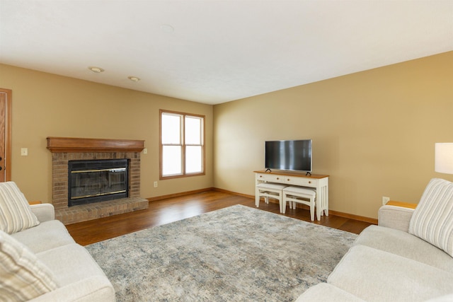 living room featuring hardwood / wood-style flooring and a fireplace