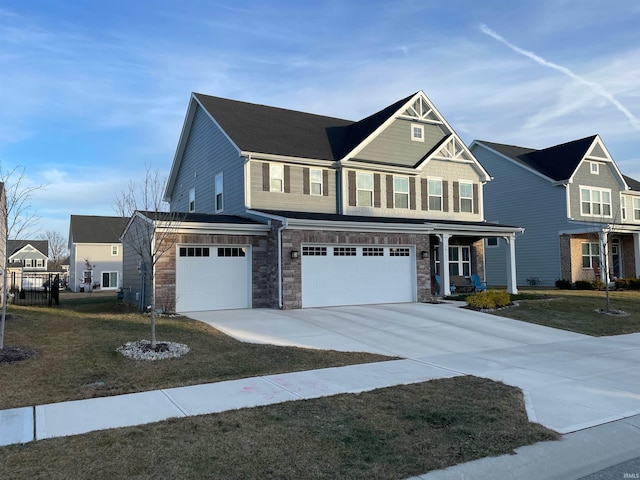 view of front facade with a garage and a front yard