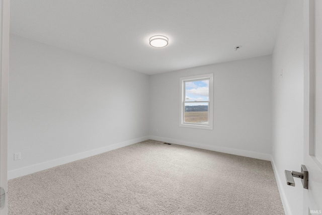 unfurnished room with carpet floors