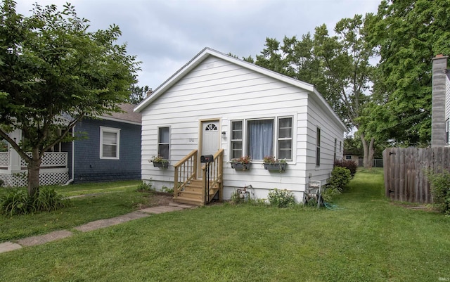 bungalow-style house with a front yard