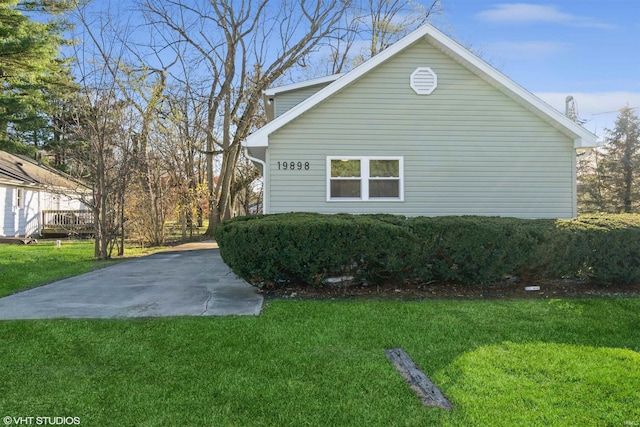 view of home's exterior featuring a lawn