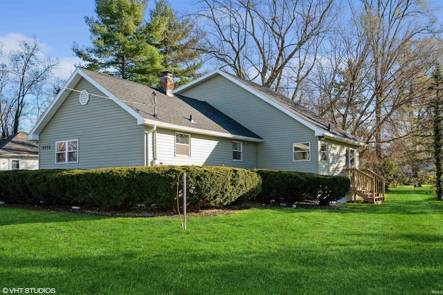 view of side of property featuring a yard