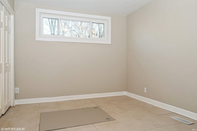 spare room with light tile patterned flooring