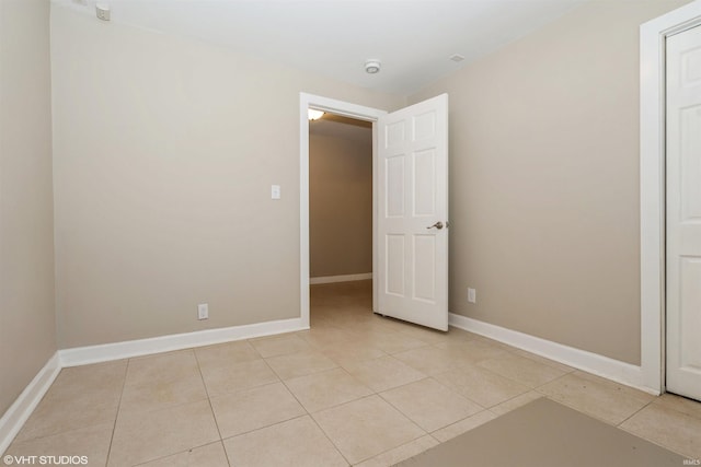 unfurnished bedroom featuring light tile patterned flooring