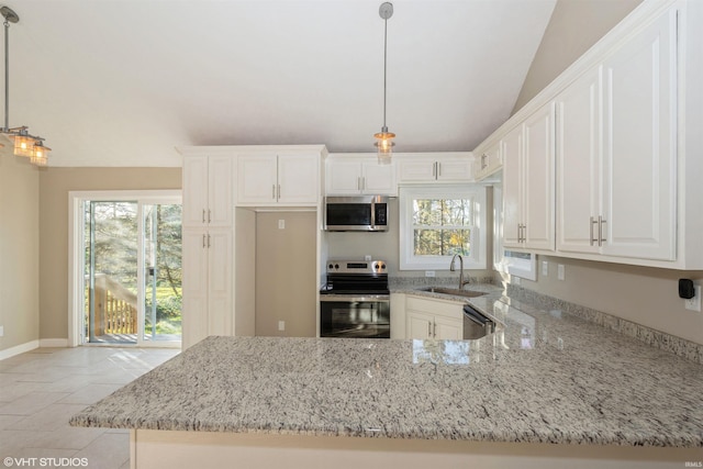 kitchen with stainless steel appliances, sink, pendant lighting, a healthy amount of sunlight, and white cabinets