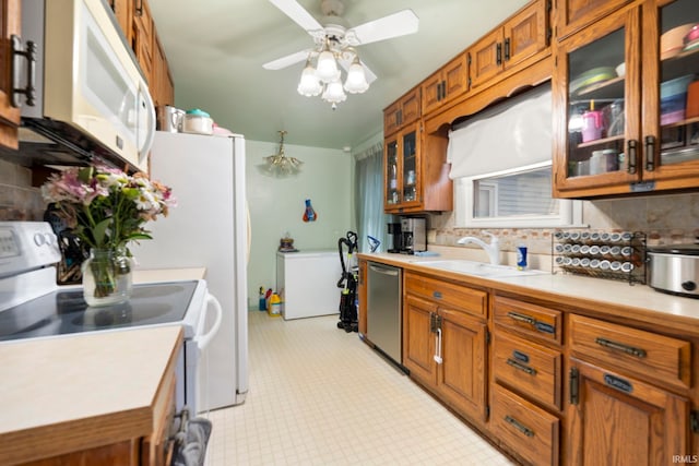 kitchen featuring tasteful backsplash, sink, white appliances, and ceiling fan