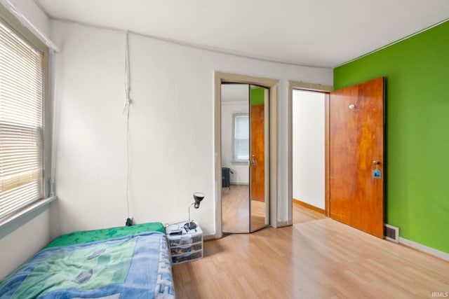 bedroom featuring light wood-type flooring