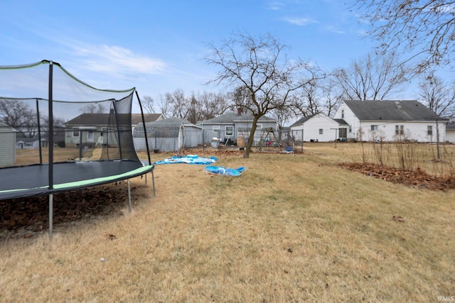 view of yard with a trampoline