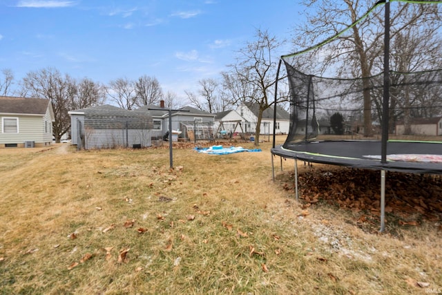 view of yard with a trampoline