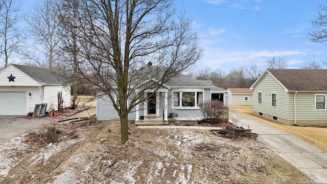 view of front of house featuring a garage and an outdoor structure