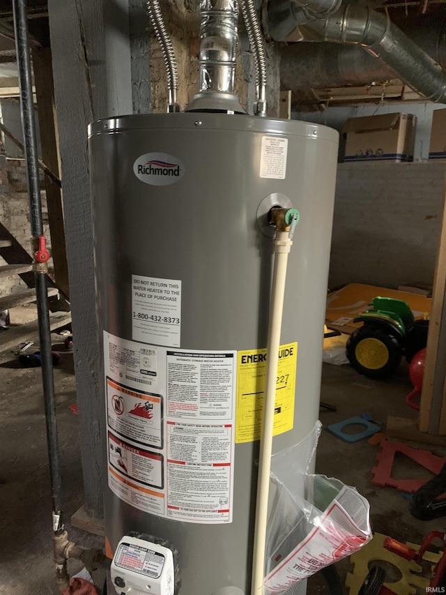 utility room featuring water heater