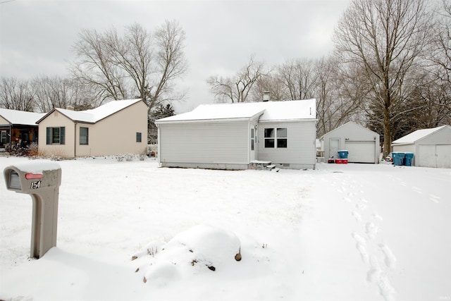 view of front of property featuring an outbuilding and a garage