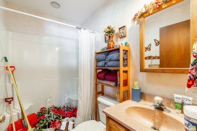 bathroom with vanity and toilet