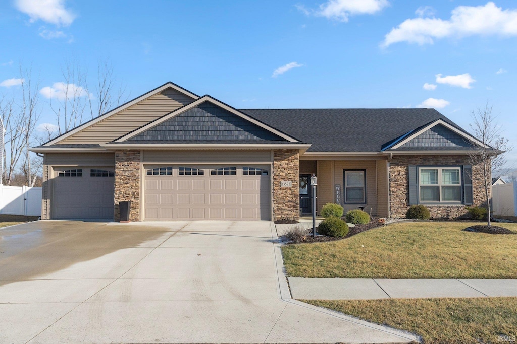 view of front facade featuring a garage and a front lawn