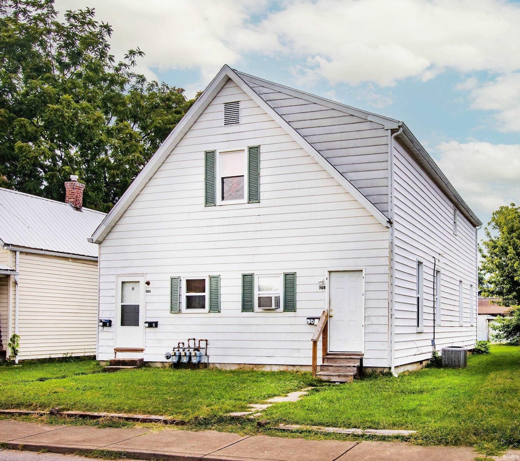 view of front of home featuring cooling unit, central air condition unit, and a front lawn