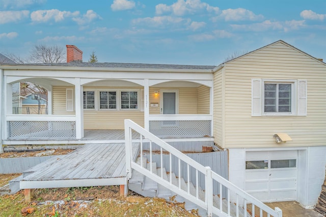 view of exterior entry with a garage