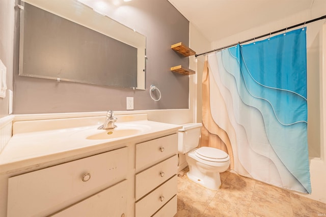 bathroom with a shower with curtain, tile patterned floors, vanity, and toilet