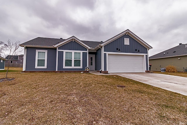 view of front of house with a garage and a front yard