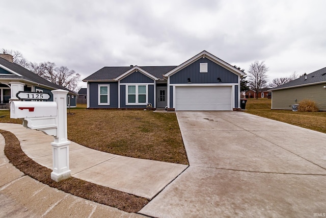 single story home featuring a garage and a front lawn