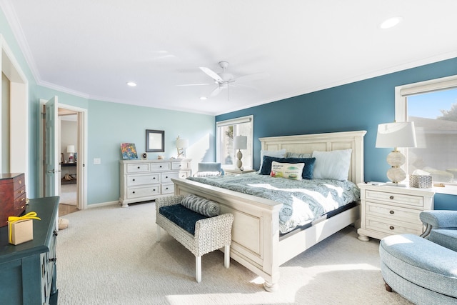 carpeted bedroom featuring crown molding and ceiling fan