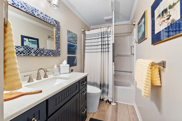 full bathroom with hardwood / wood-style flooring, vanity, shower / tub combo, toilet, and a textured ceiling