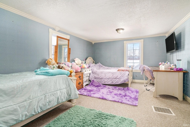 carpeted bedroom with crown molding and a textured ceiling