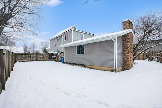 view of snow covered house