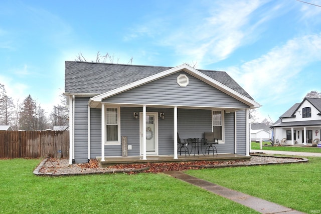 bungalow-style house with a porch and a front lawn