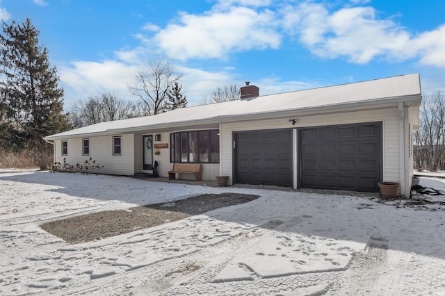 ranch-style home with a garage