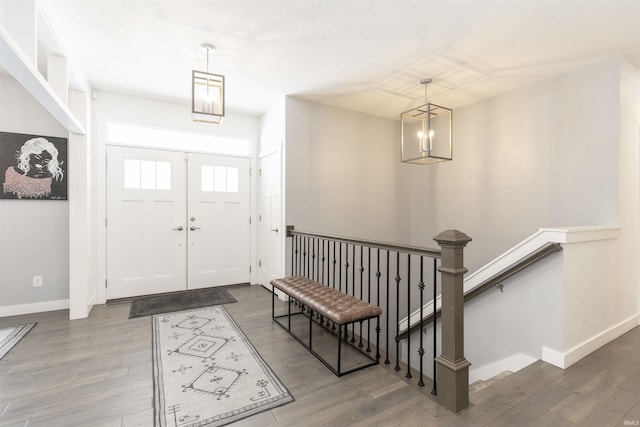 foyer featuring hardwood / wood-style flooring and a chandelier