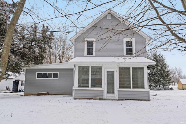 view of snow covered house