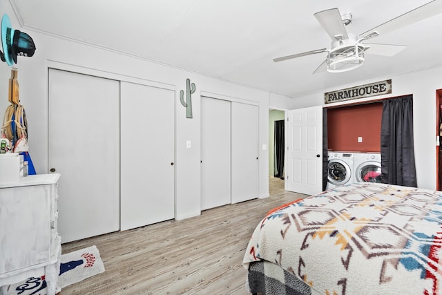 bedroom with multiple closets, ceiling fan, light hardwood / wood-style floors, and washer and dryer